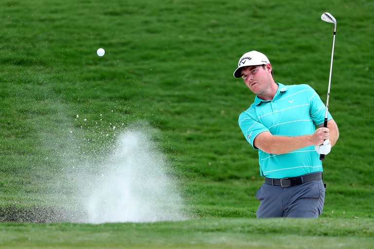 CHARLOTTE, NC - AUGUST 10:  Grayson Murray of the United States plays his shot out of the bunker on the 18th green during the first round of the 2017 PGA Championship at Quail Hollow Club on August 10, 2017 in Charlotte, North Carolina.  (Photo by Warren Little/Getty Images)