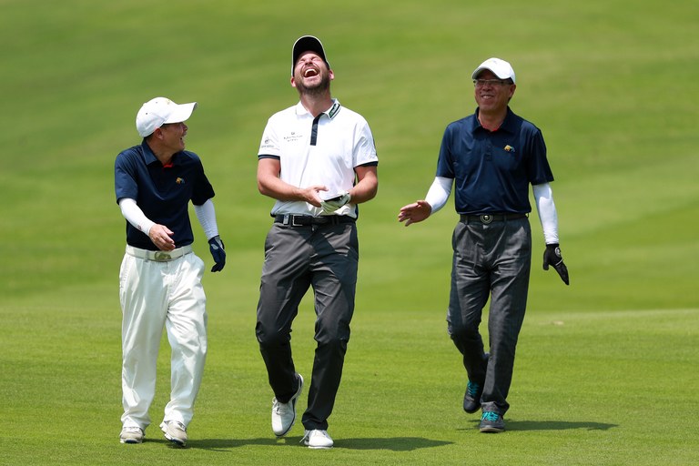 SHENZHEN, CHINA - APRIL 19: David Howell of England(in the middle) reacts with amatuer players during the pro-am prior to the start of the Shenzhen International at Genzon Golf Club on April 19, 2017 in Shenzhen, China. (Photo by Zhong Zhi/Getty Images)