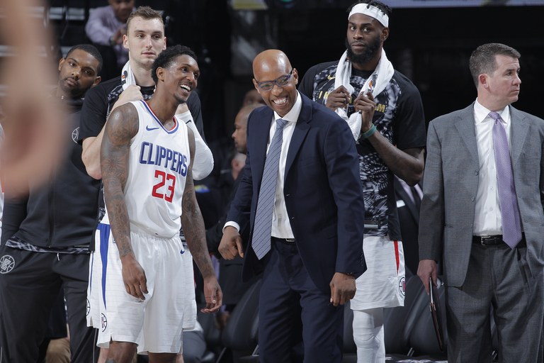 SACRAMENTO, CA - JANUARY 11: Lou Williams #23 and assistant coach Sam Cassell of the Los Angeles Clippers smile during the game against the Sacramento Kings on January 11, 2018 at Golden 1 Center in Sacramento, California. (Photo by Rocky Widner/NBAE via Getty Images)