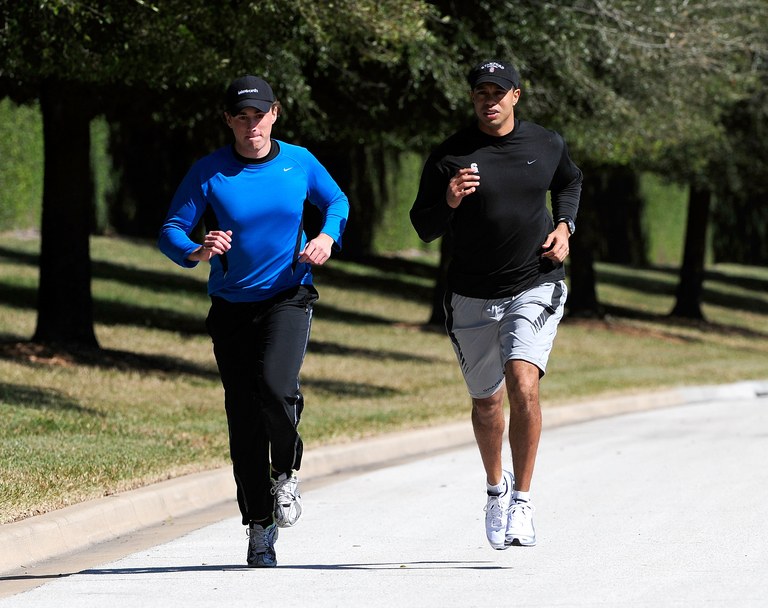 ORLANDO, FL - FEBRUARY 17: Tiger Woods (R) jogs with an unidentified friend near his home on February 17, 2010 in Orlando, Florida. (Photo by Sam Greenwood/Getty Images)