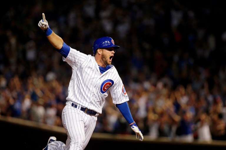 David Bote of the Chicago Cubs celebrates as he rounds the bases after hitting a walk-off grand slam against the Washington Nationals at Wrigley Field on August 12, 2018 in Chicago, Illinois. The Chicago Cubs won 4-3.  