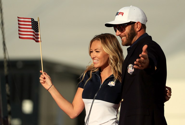 Dustin Johnson celebrates with Paulina Gretzky after winning the Ryder Cup during singles matches of the 2016 Ryder Cup at Hazeltine National Golf Club.