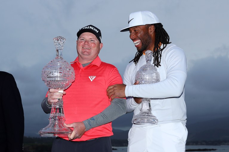 Ted Potter Jr. (L) and Larry Fitzgerald celebrate after winning the 2018 AT&T Pebble Beach Pro-Am.