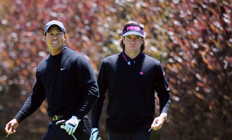 Tiger Woods of the US walks past compatr
