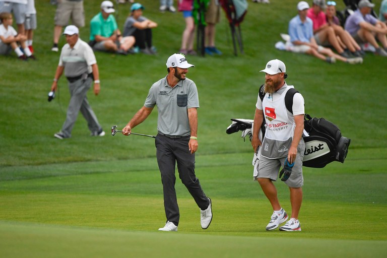 Max Homa laughs with his caddie Joe Greiner during the final round of the 2019 Wells Fargo Championship.